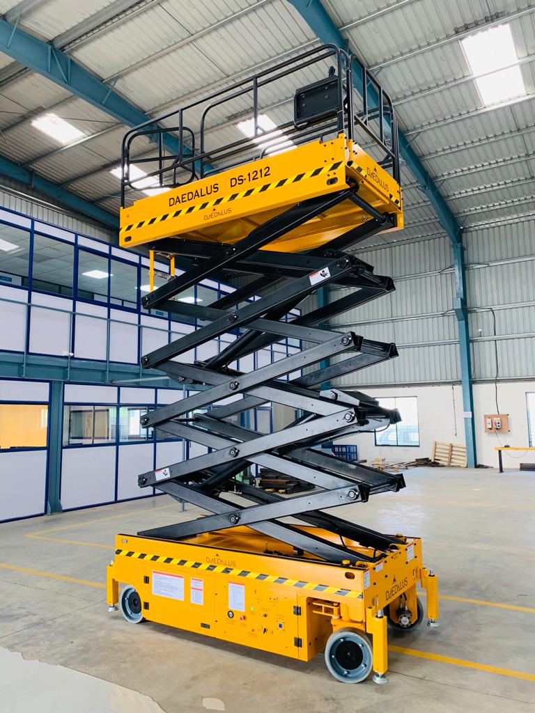Daedalus DS-1212 electric scissor lift platform inside industrial warehouse facility